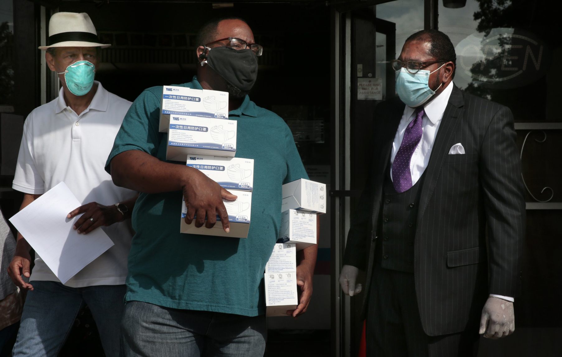 Clergy distributing masks to area churches
